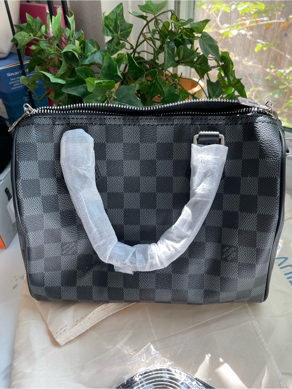 Black and gray checkered satchel